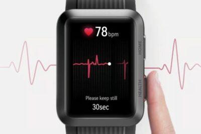 An ECG graph in background with a rectangular shaped smartwatch in foreground showing a heart rate graph, and a 78 bpm reading