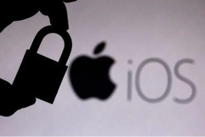 Silhouette of a hand holding a padlock, with an Apple logo in background, and letters iOS