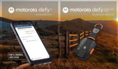 Background shows rural countryside with a wooden fence. Foreground shows a smartphone and a black and orange key fob