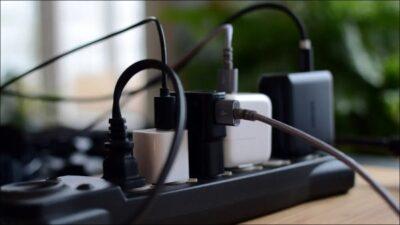 A multiplug with a whole lot of chargers plugged in