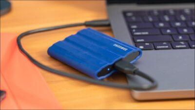 A laptop with an SSD drive plugged into a USB port