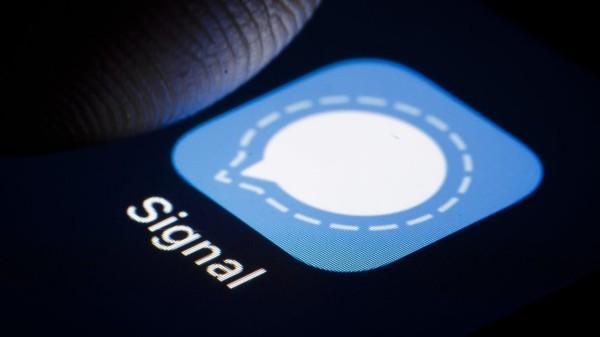 Signal icon on phone screen with caption Signal; under it, and a finger hovering over the icon.