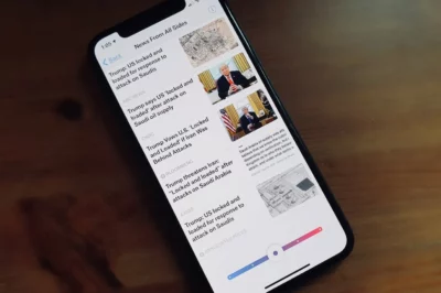 Smartphone tilted to the left, showing a screen with title News From All Sides, with a list of news article headlines down the screen.
