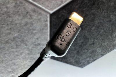 One end of a USB-C cable showing it has engraved upon it 3.0 5 Gb/s.
