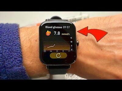 A wrist with a square faced smart watch, which is showing a blood glucose reading of 7.8 mmol/L