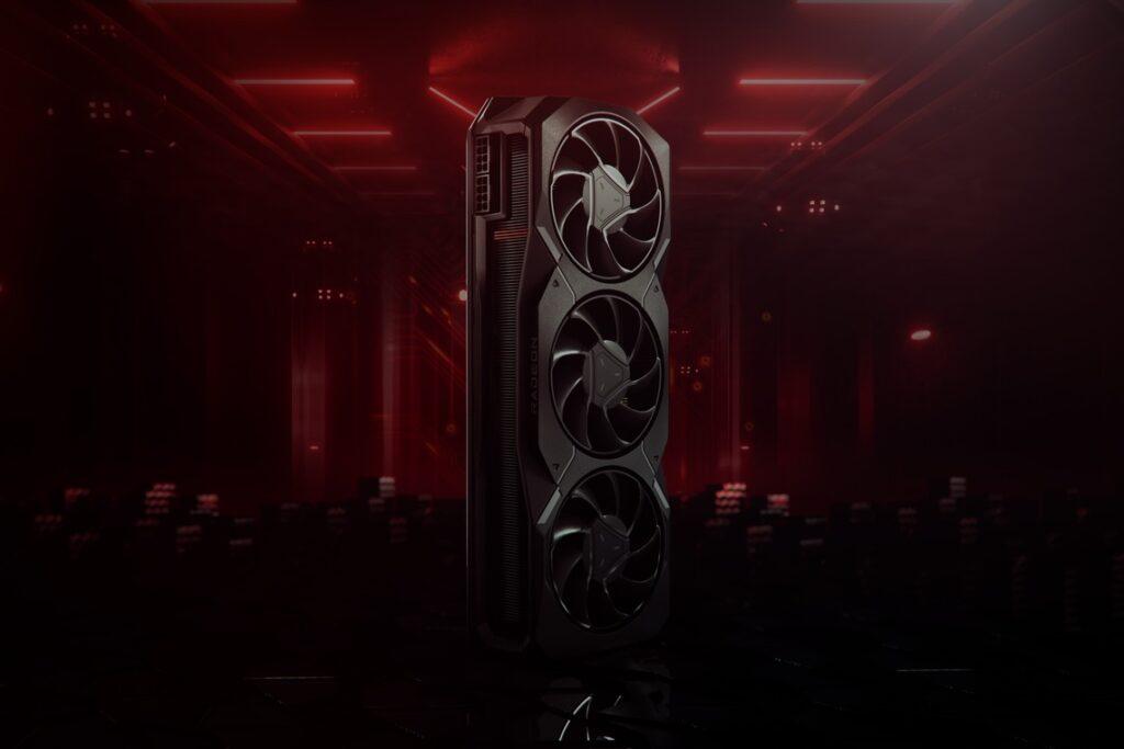 Red blurry background with an AMD gaphics card standing up verrtically in the foreground. On one side are three cooling fans, and on the narrower facing side are some cooling fins.