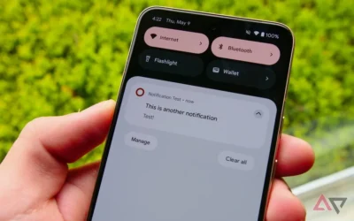 Smartphone being held by a hand. Screen shows open notificatiosn screen saying Notification test now. This is another notification. Below it is a button marked Manage another button Clear all. Above it are a buttons for Internet, Bluetooth, Flashlight, and Wallet.