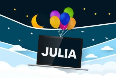 A laptop suspended in the air by 6 colourful balloons. The screen shows the word JULIA.