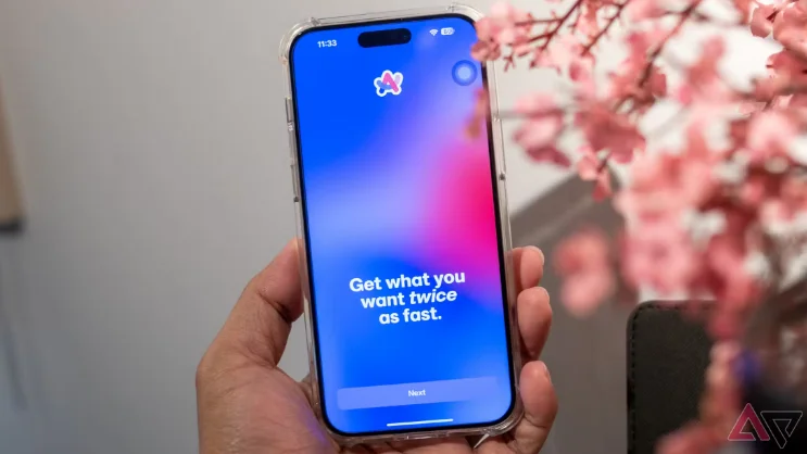 Hand holding a smartphone. The screen is blue and a caption in white says “Get what you want twice as fast”.