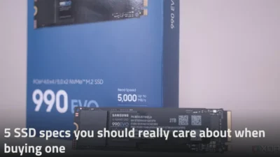 IN the foreground is a single SSD drive labelled Samsung V-NAND SSDD 990EVO. In the background is part of its outer box packaging in a blue colour. In the foreground is the title of the post.