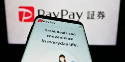 Smartphone screen showing a red logo with letter P on it and a name PayPay next to it. Below is the text Great deals and convenience in everyday life!