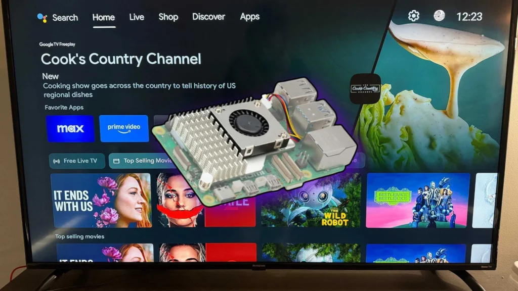 TV screen in the background showing a title on i: Cook's Country Channel. In the foreground is a Raspberry Pi computer with a CPU fan fitted to it.