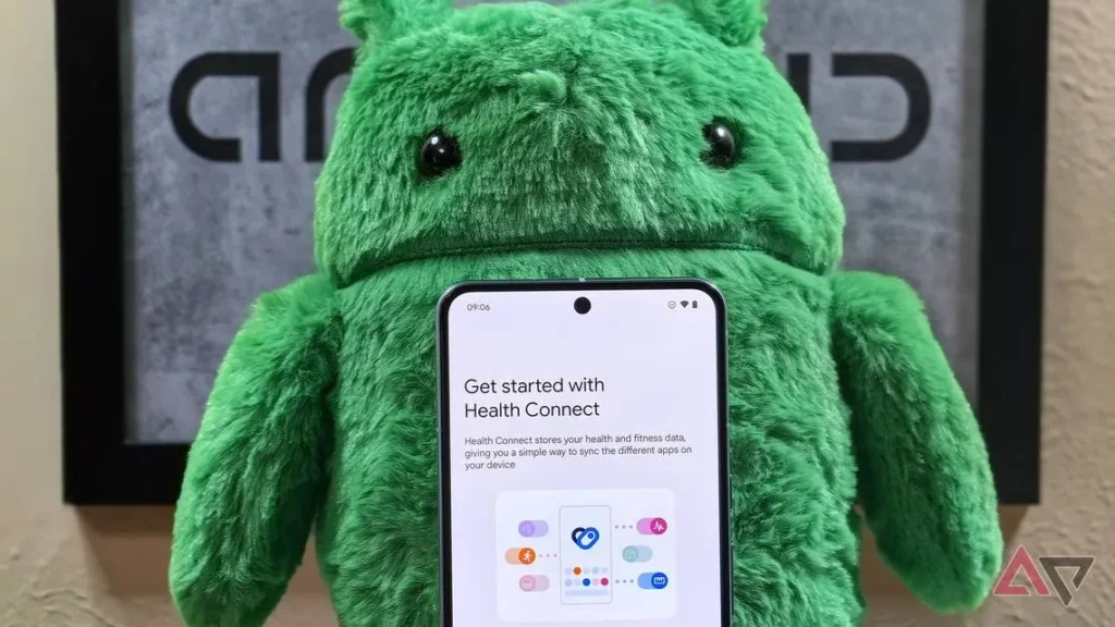 A furry green Android character. In front of it can be seen the top half of a smartphone screen showing the title Get started with Health Connect.