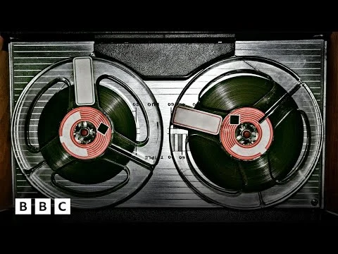 Top view of a vintage reel-to-reel tape recorder, showing the two reels.