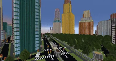 The image shows a city scene, in the style of a Minecraft video game. In the foreground, there is a wide road with crosswalks and what looks like a bus stop or a small transit station. The background is dominated by skyscrapers of varying heights and colors, showcasing a mix of architectural styles. There are green spaces visible between some of the buildings, hinting at parks or planned landscaping.