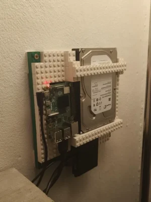 A Raspberry Pi mounted on LEGO bricks with an attached hard drive and cables.