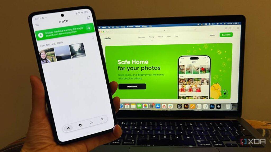 A hand holds a smartphone displaying photo storage app, while a laptop shows the app's website featuring green design and privacy features.