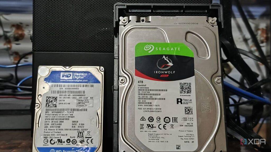 A Western Digital and a Seagate IronWolf hard drive side by side, both displaying their labels and specifications.