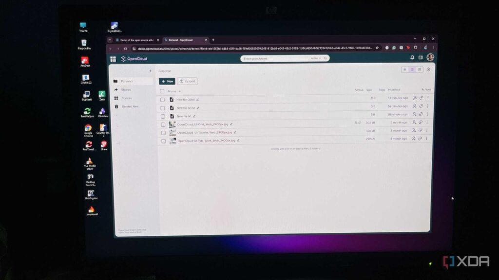 Screenshot of OpenCloud interface displaying personal files with options to upload, view details, and manage files on a dark screen.