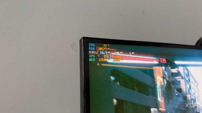 A computer monitor displaying performance metrics: CPU temperature (72°C), RAM usage, FPS, GPU temperature, and memory usage statistics.