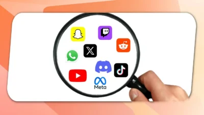 A hand holds a magnifying glass over popular social media app icons, including Snapchat, Twitter, and YouTube, on a light background.