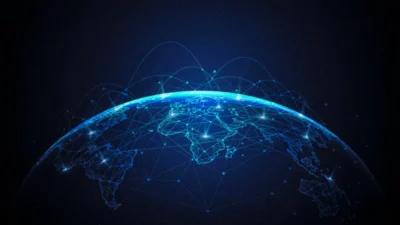 A digital globe overlayed with glowing blue network lines and nodes, symbolizing global connectivity and communication.