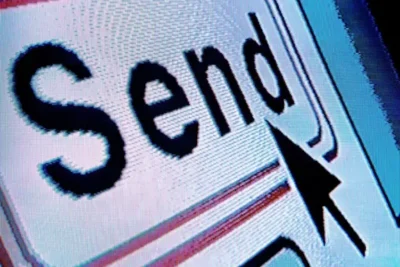 Close-up of a computer screen displaying the word "Send" with a mouse cursor hovering over it, indicating a digital action prompt.