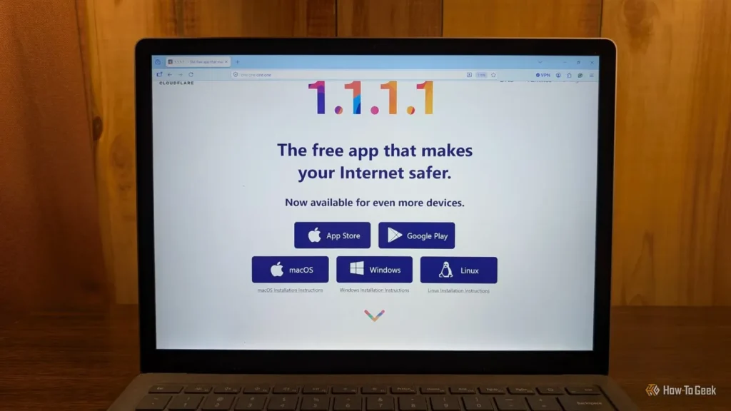 Laptop screen displaying Cloudflare's 1.1.1.1 app homepage promoting safer internet access across multiple platforms.