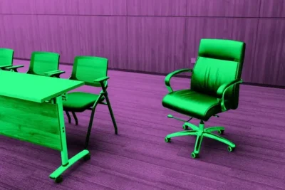 Office meeting room with green chairs and a wooden table on purple carpet and wall background.