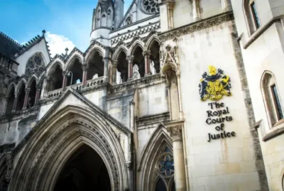 Microsoft is losing the battle to protect license lucre. It better get used to the feeling 6 Exterior view of The Royal Courts of Justice building with Gothic-style architecture and a blue sky background.