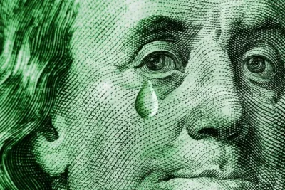 OpenAI Exec Laments That China Is Giving Away Models So Good That For-Profit Companies Won’t Be Able to Compete 2 Close-up of Benjamin Franklin's face from a US $100 bill with a single tear drop.